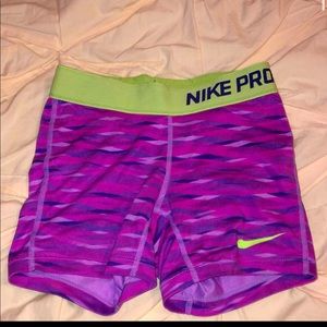 pink and green nike pros